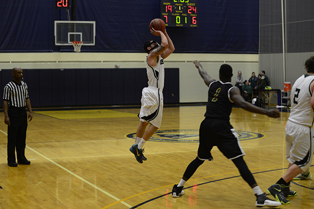 Regis Hangs On Late to Score Win Over Men's Basketball