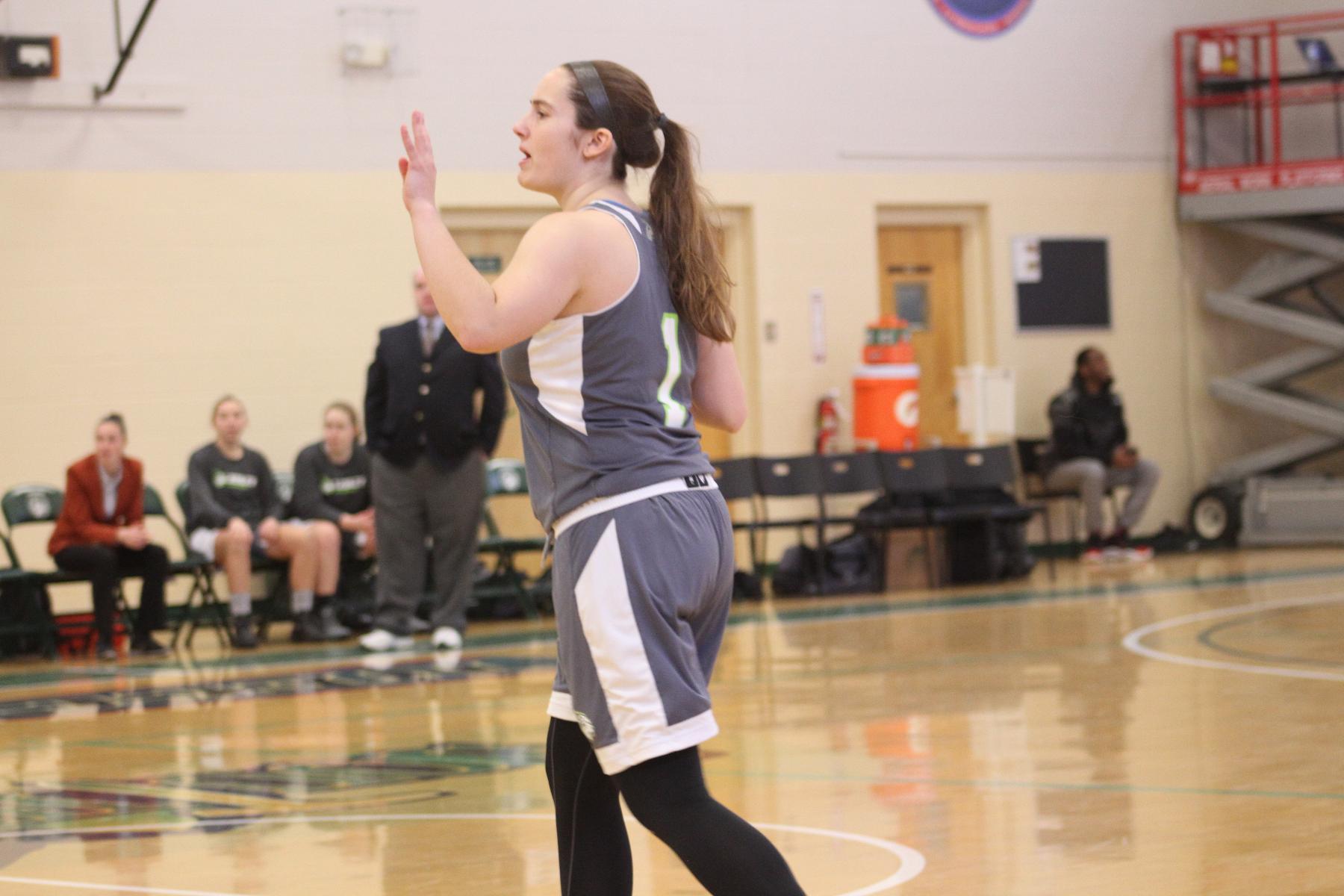 Newbury Fends Off Women's Basketball